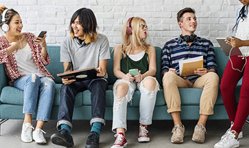 A group of students sitting on a couch